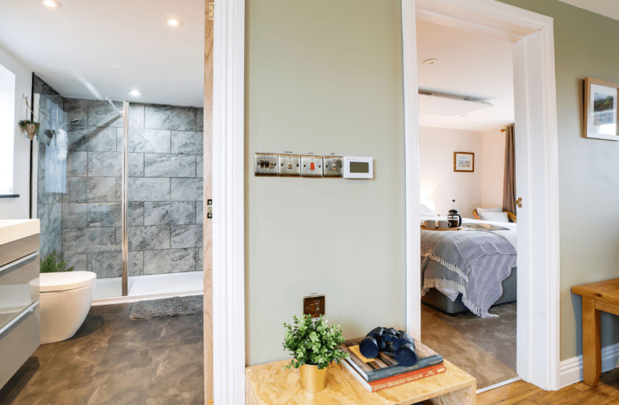 View from the bedroom showing the adjoined bathroom and a glimpse of the bedroom at the Tractor Shed.