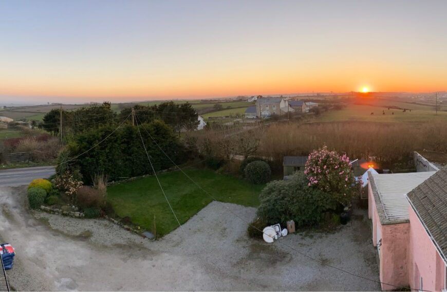 A panoramic view of the Cornish countryside at sunset, taken from Trewena.