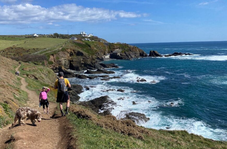 A breathtaking view of Lizard Point, the southernmost tip of mainland Britain, with rugged cliffs and the Atlantic Ocean stretching to the horizon.