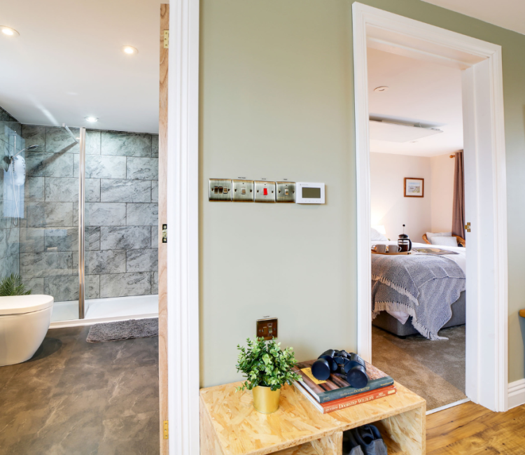 View from the bedroom showing the adjoined bathroom and a glimpse of the bedroom at the Tractor Shed.